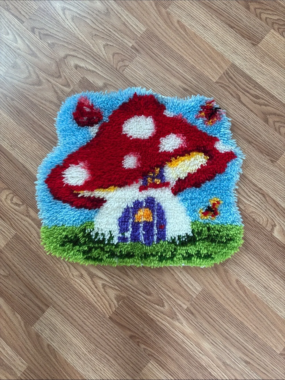 Whimsical Red Mushroom Door Mat with Blue Sky and Green Grass